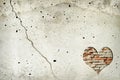 Heart shape made of old bricks on concrete wall. Valentines day background with heart shape and copy space Royalty Free Stock Photo