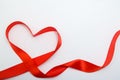 Heart shape made of red ribbon on white wooden Background. copy space - Valentines and 8 March Mother Women& x27;s Day concept Royalty Free Stock Photo