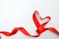 Heart shape made of red ribbon on white wooden Background. copy space - Valentines and 8 March Mother Women& x27;s Day concept Royalty Free Stock Photo