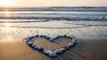 Heart shape made of shells on beach at sunset Royalty Free Stock Photo