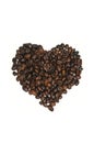 Heart shape made with some fresh roasted coffee beans isolated on white background Royalty Free Stock Photo