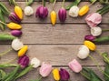 Heart shape made of tulips on wooden background, top view Royalty Free Stock Photo