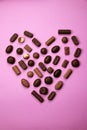 Heart shape made with various types of chocolate.Saint Valentines day concept Royalty Free Stock Photo