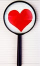 Heart Shape and Magnifying Glass Royalty Free Stock Photo