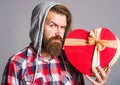 Heart shape. Man with valentines gift. Present with love. Presents and gifts. Royalty Free Stock Photo