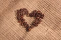 Heart shape from natural brown roasted coffee beans.