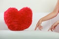 Heart shape pillow on sofa. Valentines day love. Royalty Free Stock Photo