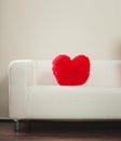 Heart shape pillow on sofa. Valentines day love. Royalty Free Stock Photo