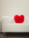 Heart shape pillow on sofa. Valentines day love. Royalty Free Stock Photo