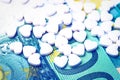 Heart-shape pills on the background of euro bills. The concept of the expensive cost of healthcare Royalty Free Stock Photo