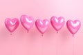 Heart shape pink balloons. Valentine's Day or Mother's Day elements against pink background