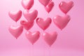 Heart shape pink balloons. Valentine's Day or Mother's Day elements against pink background