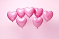 Heart shape pink balloons. Valentine's Day or Mother's Day elements against pink background