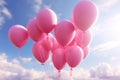 Heart shape pink balloons. Valentine's Day or Mother's Day elements against blue sky background