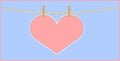 Heart shape pink paper hanging with clothespin Royalty Free Stock Photo