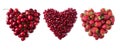 Heart shape red cherries, strawberries and pomegranate seeds  on white background. Background made of cherry, pomegranate and stra Royalty Free Stock Photo