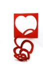 Heart shape red spiral. Three dimensional heart shape. Red paper cut in continuous heart shape.