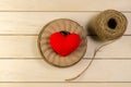 heart shape with roll of twine cord on blank wooden board , vale Royalty Free Stock Photo