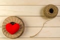 heart shape with roll of twine cord on blank wooden board , vale Royalty Free Stock Photo