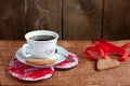 Heart shape Saint Valentine's Cookie and cup of coffee with stea