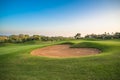 Heart shape sand bunker on the green golf course. Royalty Free Stock Photo