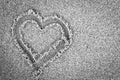 Heart shape on sand. Romantic, black and white