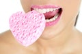 Heart shape sponge on woman macro mouth Royalty Free Stock Photo