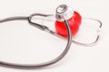 Heart shape with stethoscope on the white background. Heart illness, disease protection, proactive checkup, mind diagnosis