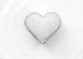 Heart shape by white granulated sugar on the pile sugar background for valentines day and love element concept design. Royalty Free Stock Photo