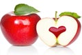 Heart-shaped apple slice and whole red apple with leaves Royalty Free Stock Photo