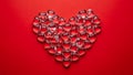 Heart-shaped arrangement of red glass pieces Royalty Free Stock Photo