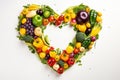 Heart shaped assortment of fresh fruits and vegetables isolated on white background, top view Royalty Free Stock Photo