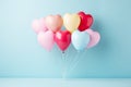 Heart shaped balloons on blue pastel background for love, valentine, wedding, birthday concepts