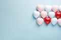 Heart shaped balloons on blue pastel background for love in valentine, wedding, birthday concepts