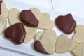 Heart shaped biscuit cookies. Some cookies are decorated with dark chocolate. Some cookies are decorated with white chocolate Royalty Free Stock Photo