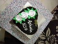 A heart shaped black forest birthday cake of 500 grams is put on a white coloured desk.