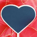 Heart shaped blackboard on red bow with copy space Royalty Free Stock Photo