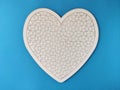 Heart shaped blank white jigsaw puzzle on blue background Royalty Free Stock Photo