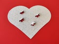 Heart shaped blank white jigsaw puzzle on red background puzzle pieces completing the heart shape Royalty Free Stock Photo