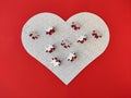 Heart shaped blank white jigsaw puzzle on red background puzzle pieces completing the heart shape Royalty Free Stock Photo