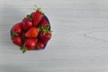 Heart shaped bowl with berries. Royalty Free Stock Photo