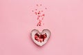 Heart shaped bowl with splash of red confetti Royalty Free Stock Photo