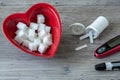 Heart shaped bowl and sugar cubes. Diabetes testing Royalty Free Stock Photo