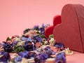 Heart shaped boxes and flower confetti or potpourri on a pink background. Royalty Free Stock Photo