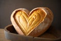 heart-shaped bread loaf with a soft, chewy interior and golden crust