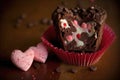 heart-shaped brownie with pink heart, red and white polka dot baking cups, and chocolate chips