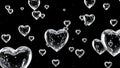 Clear heart bubbles floating on black background Royalty Free Stock Photo