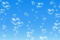 Heart shaped bubbles underwater on blue background Royalty Free Stock Photo