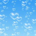 Heart shaped bubbles in water on blue background Royalty Free Stock Photo