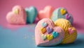 a heart shaped cake sitting on top of a blue table next to other heart shaped cakes on a pink and blue surface with sprinkles.